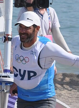 Pavlos Kontides on a sailing dock in Olympic gear